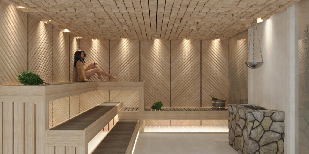 a woman sitting in a wooden sauna