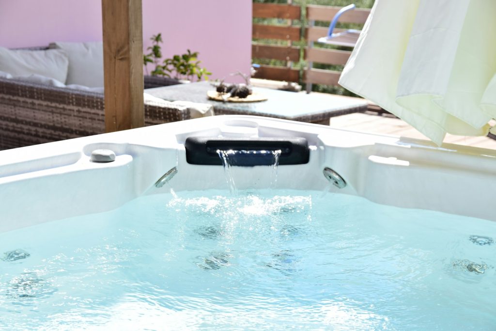 a pool with a chair and a table in the background